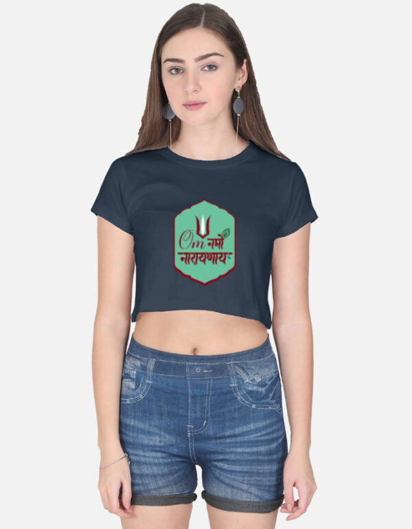 A woman wearing a navy blue half-sleeve crop top with a green badge graphic featuring the "Om Namo Narayanaya" mantra in Devanagari script.