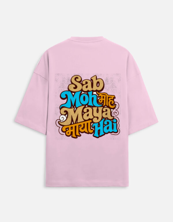 Unisex light baby pink terry oversized t-shirt featuring a colorful retro typography graphic print on the back with the phrase "Sab Moh Maya Hai" in English and Devanagari script.