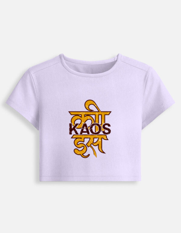 Lavender fitted baby tee featuring a yellow Devanagari script typography graphic on the front with "KAOS" printed across it.