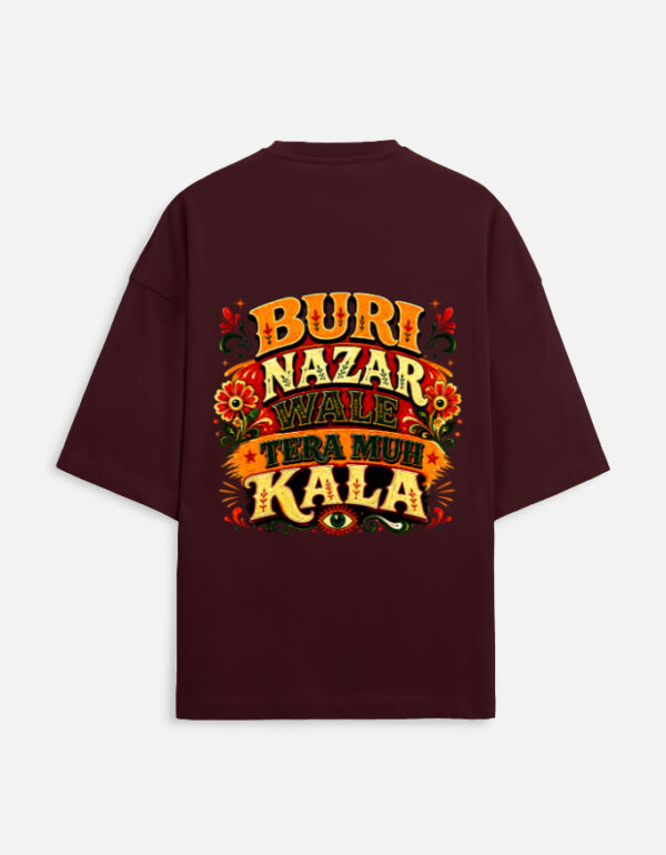 Unisex maroon terry oversized t-shirt featuring a vibrant Indian truck-art style typography graphic print on the back with the phrase "Buri Nazar Wale Tera Muh Kala" and a protective evil eye motif.