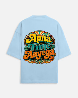Unisex baby blue terry oversized t-shirt featuring a vibrant retro psychedelic typography print on the back with the phrase "Apna Time Aayega" in bold yellow, teal, and orange letters.