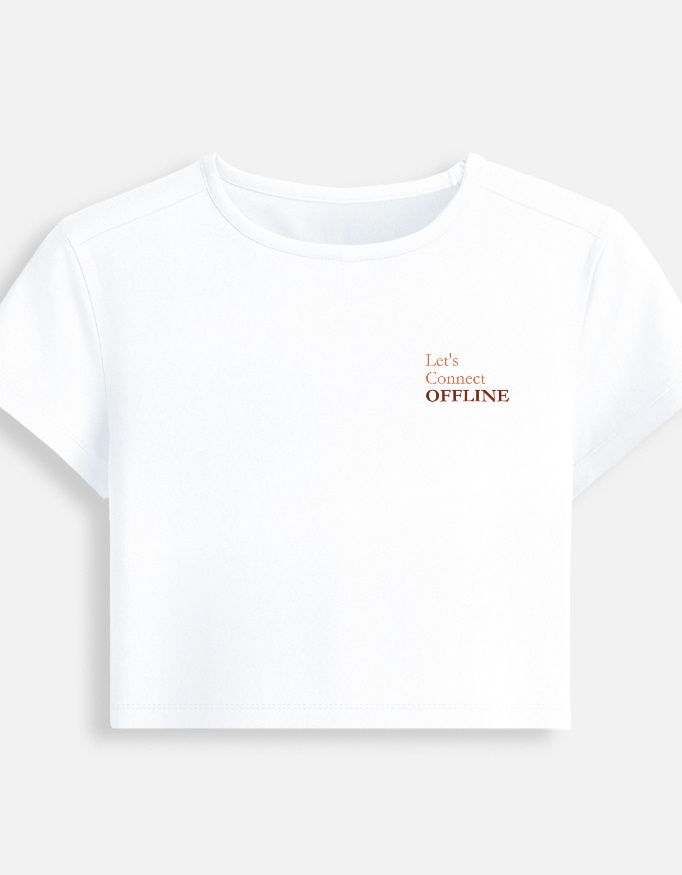 White fitted baby tee featuring a minimalist chest typography print that reads "Let's Connect OFFLINE".