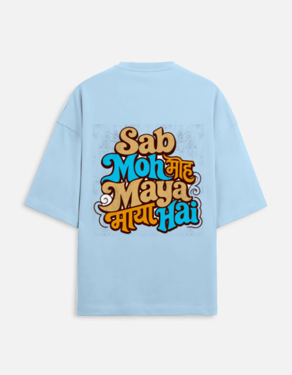 Unisex baby blue terry oversized t-shirt featuring a colorful retro typography graphic print on the back with the phrase "Sab Moh Maya Hai" in English and Devanagari script.