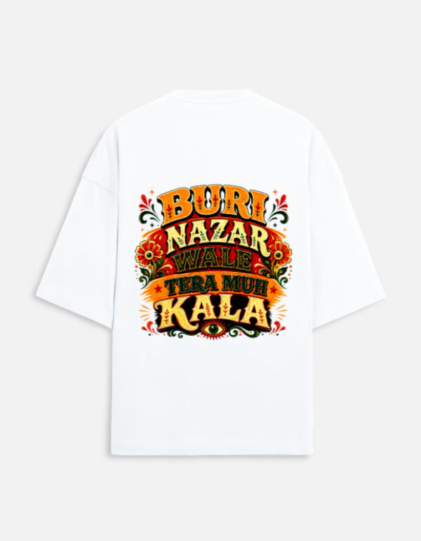 Unisex white terry oversized t-shirt featuring a vibrant Indian truck-art style typography graphic print on the back with the phrase "Buri Nazar Wale Tera Muh Kala" and a protective evil eye motif.