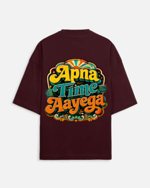 Unisex maroon terry oversized t-shirt featuring a vibrant retro psychedelic typography print on the back with the phrase "Apna Time Aayega" in bold yellow, teal, and orange letters.