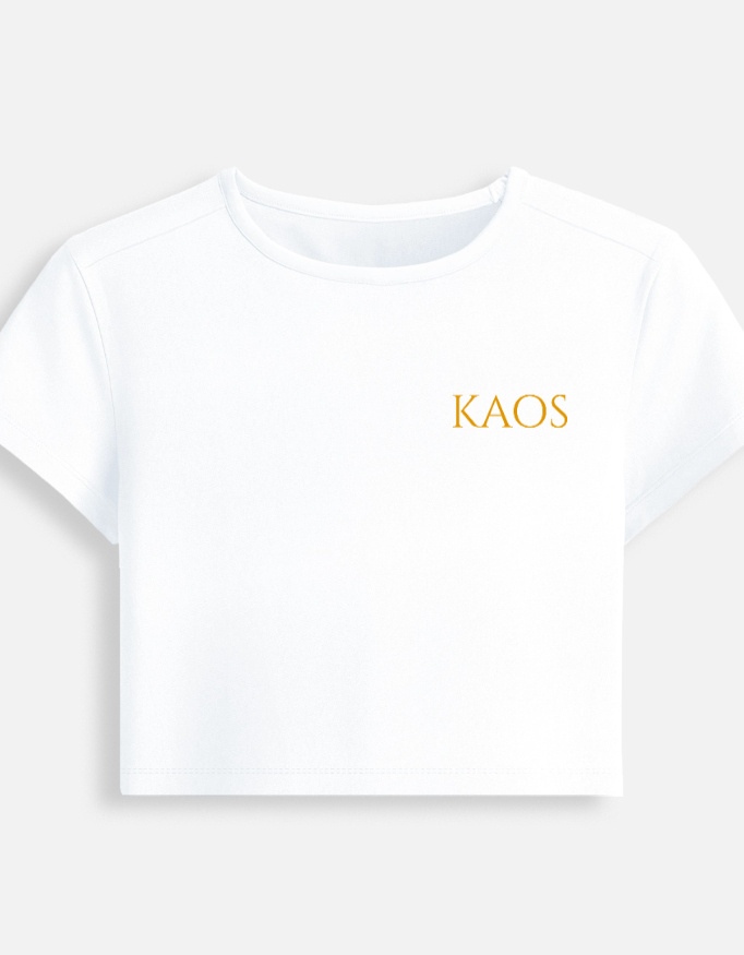 White fitted baby tee featuring a minimalist gold serif "KAOS" text logo printed on the chest.