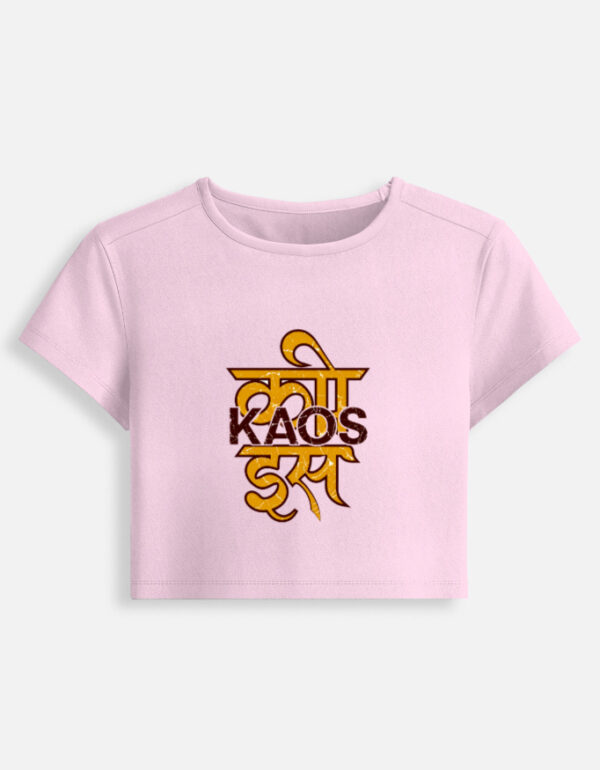 Light baby pink fitted baby tee featuring a yellow Devanagari script typography graphic on the front with "KAOS" printed across it.