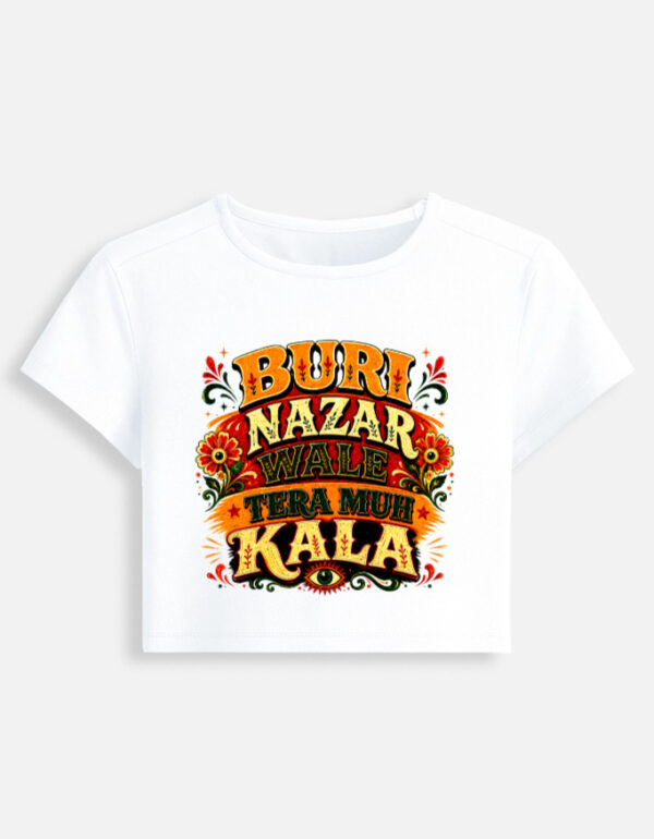White fitted baby tee featuring a vibrant Indian truck-art style typography graphic print on the front with the phrase "Buri Nazar Wale Tera Muh Kala" and a protective evil eye motif.
