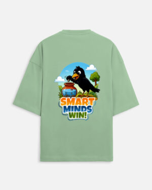 Unisex jade green terry oversized t-shirt featuring a colorful cartoon graphic on the back of a thirsty crow putting pebbles into a water pot with "Smart Minds Win!" text.