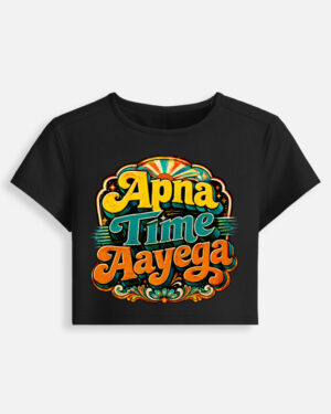 Black fitted baby tee featuring a vibrant retro psychedelic typography print on the front with the phrase "Apna Time Aayega" in bold yellow, teal, and orange letters.