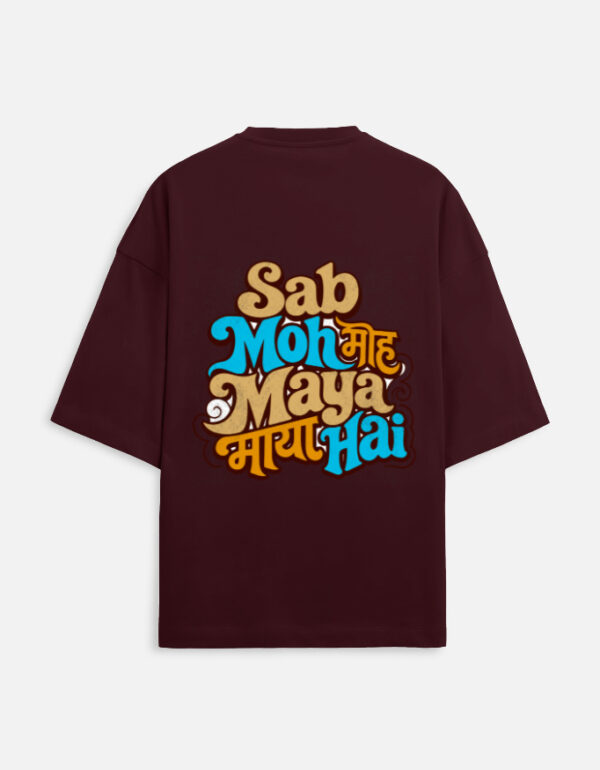 Unisex maroon terry oversized t-shirt featuring a colorful retro typography graphic print on the back with the phrase "Sab Moh Maya Hai" in English and Devanagari script.