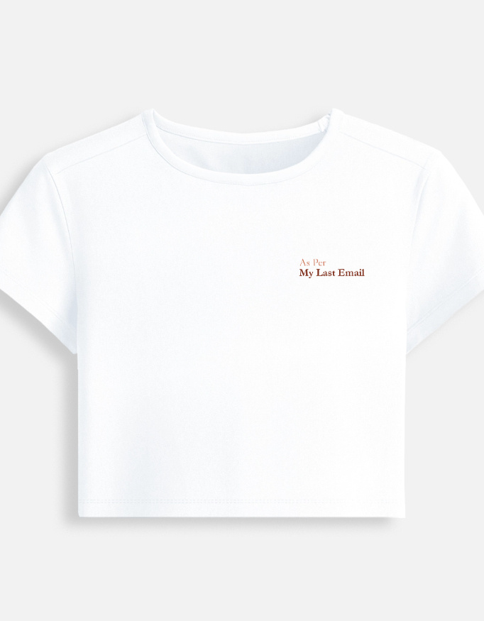 White fitted baby tee featuring a minimalist chest typography print that reads "As Per My Last Email".