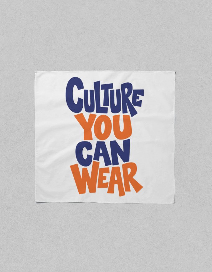 Flat lay view of a square white poly-woven satin scarf featuring blue and orange typography reading "CULTURE YOU CAN WEAR".